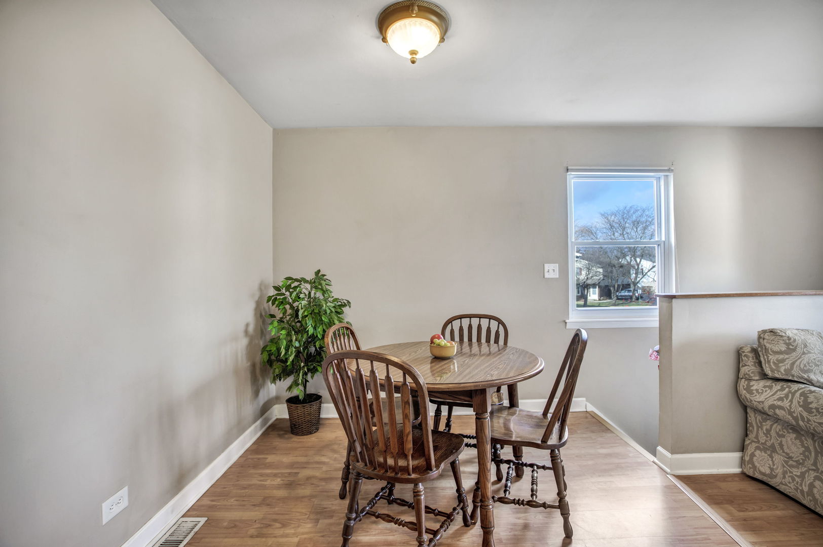 817 Pahl Road Elk Grove Village, IL 60007 - Photo 5 of 17 a view of a dining room with furniture and wooden floor