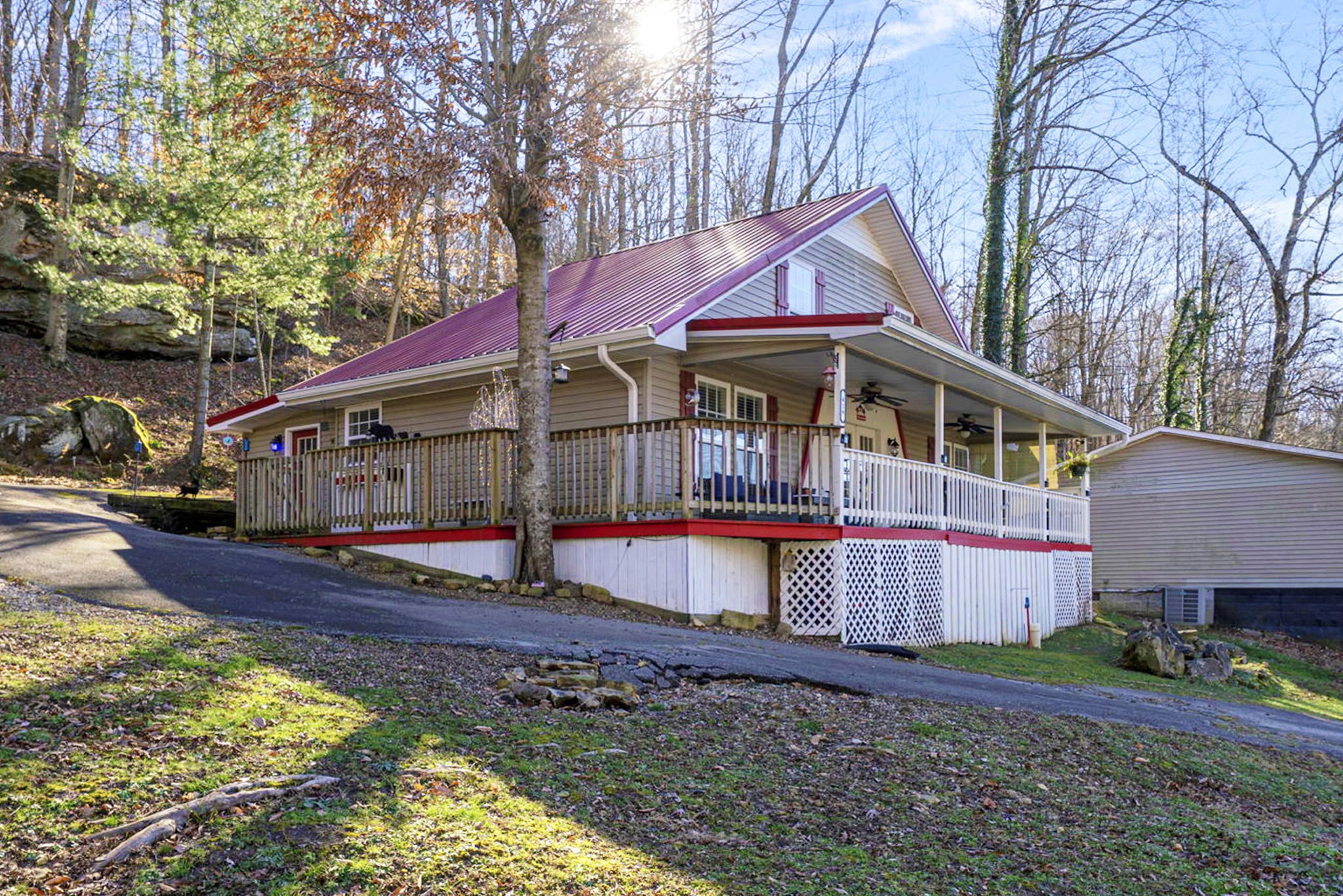 a view of house with yard and sitting area