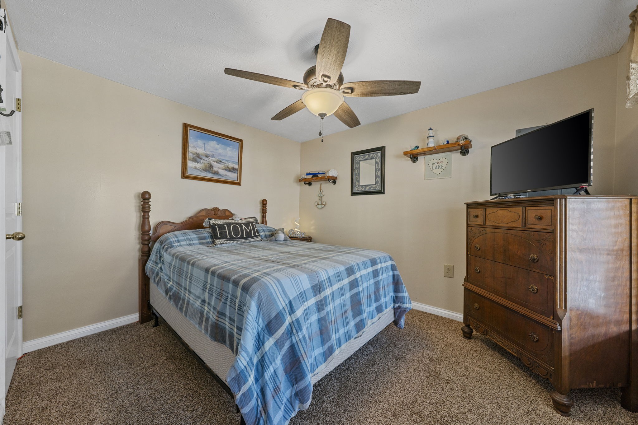 419 Jackie Dukes Road Lewisburg, KY 42256 - Photo 20 of 55 a bedroom with a bed and a flat screen tv