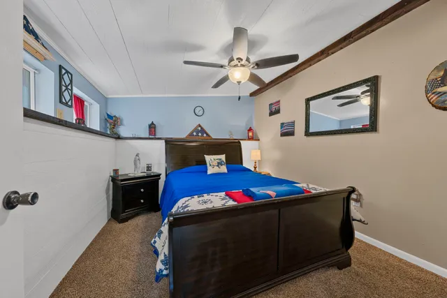 a living room with a couch and a rug