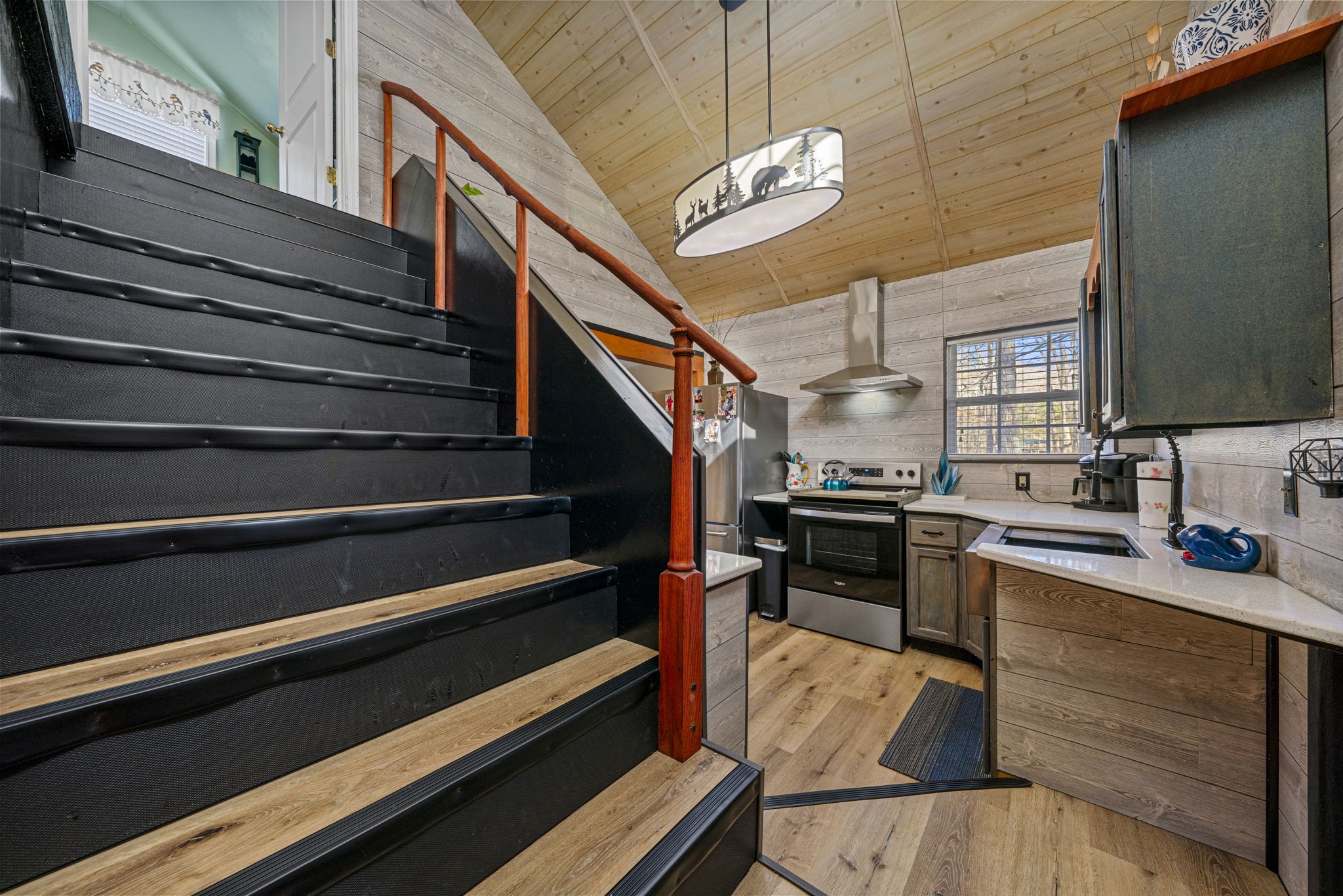 419 Jackie Dukes Road Lewisburg, KY 42256 - Photo 27 of 55 a kitchen with stove cabinets and chandelier