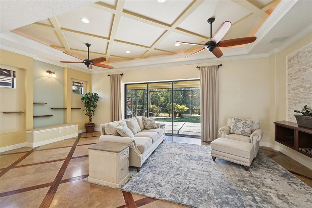 7526 Rio Bella Place Bradenton, FL 34201 - Photo 11 of 40 a living room with furniture and a ceiling fan