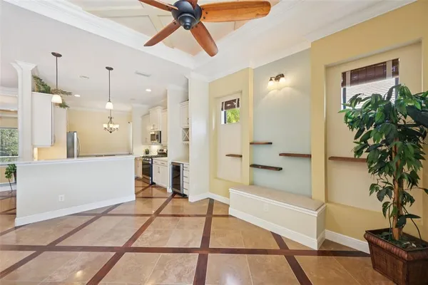 a kitchen with a refrigerator sink and cabinets