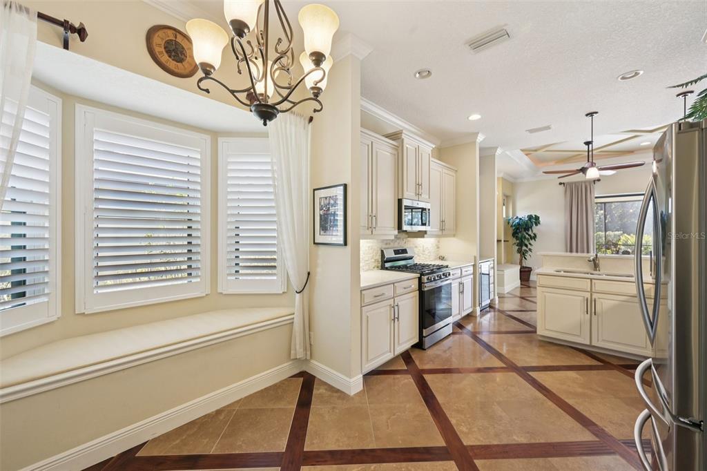7526 Rio Bella Place Bradenton, FL 34201 - Photo 15 of 40 a kitchen with a refrigerator and a sink
