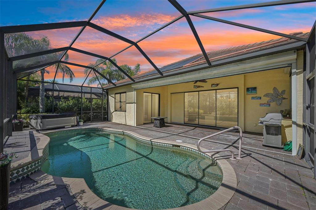7526 Rio Bella Place Bradenton, FL 34201 - Photo 17 of 40 a view of a patio with swimming pool table and chairs