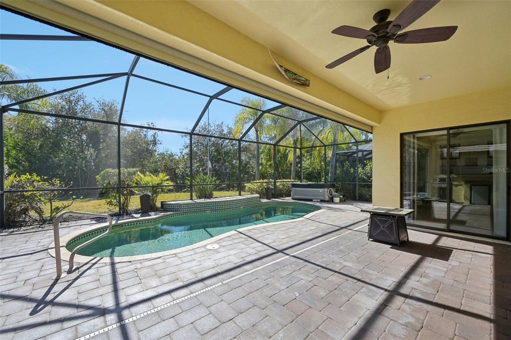 7526 Rio Bella Place Bradenton, FL 34201 - Photo 19 of 40 a view of a porch with furniture and a yard
