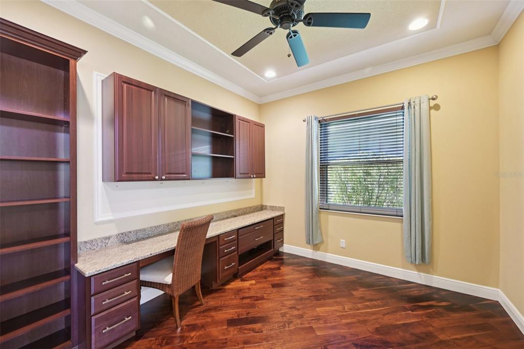 7526 Rio Bella Place Bradenton, FL 34201 - Photo 28 of 40 a kitchen with stainless steel appliances granite countertop a stove and a refrigerator