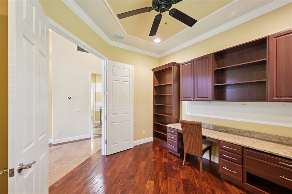 7526 Rio Bella Place Bradenton, FL 34201 - Photo 29 of 40 a living room with furniture and a ceiling fan