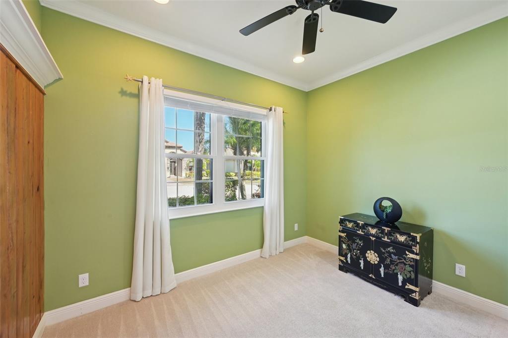 7526 Rio Bella Place Bradenton, FL 34201 - Photo 30 of 40 a bedroom with a bed and a window