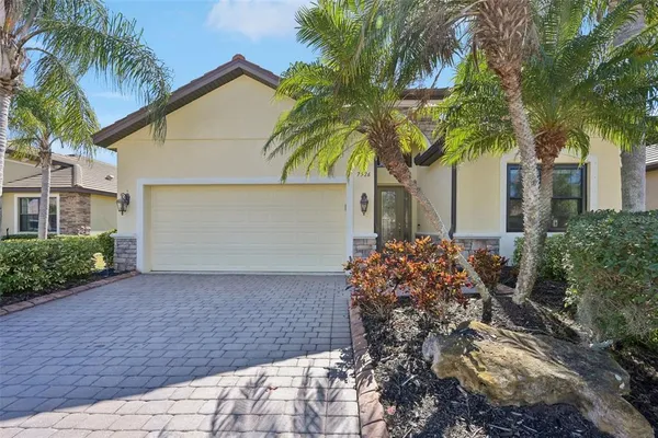 a house with palm tree in front of it