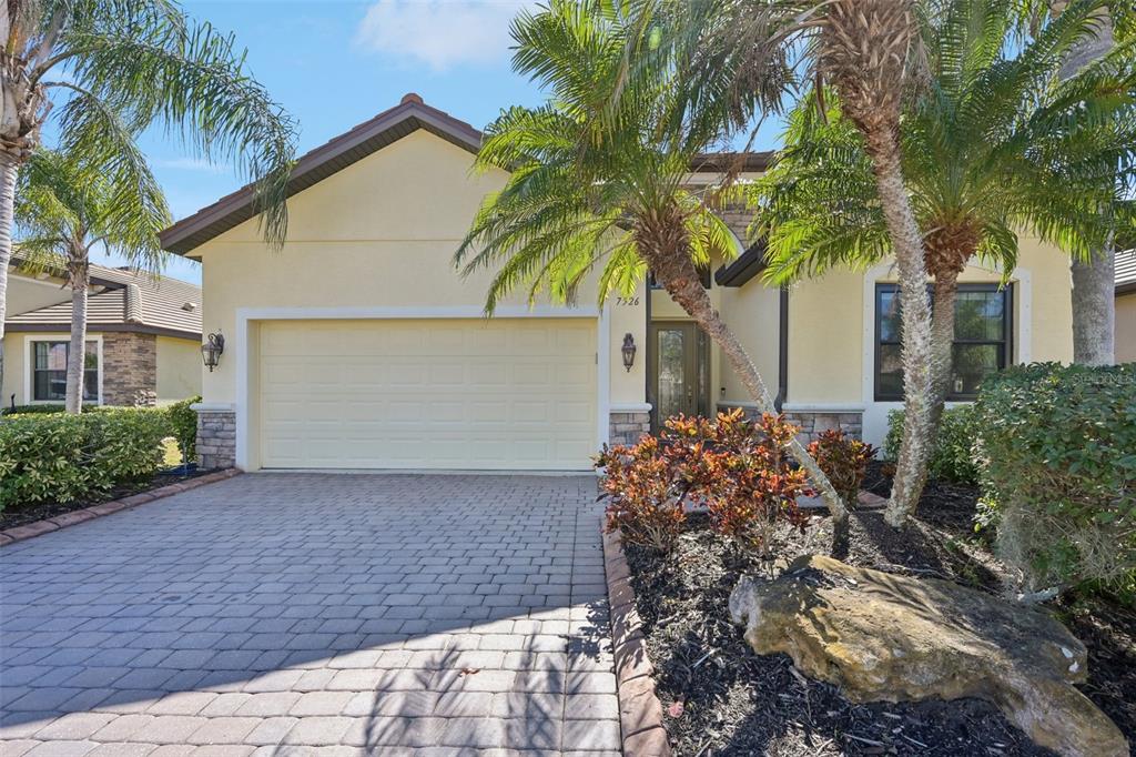 7526 Rio Bella Place Bradenton, FL 34201 - Photo 3 of 40 a house with palm tree in front of it
