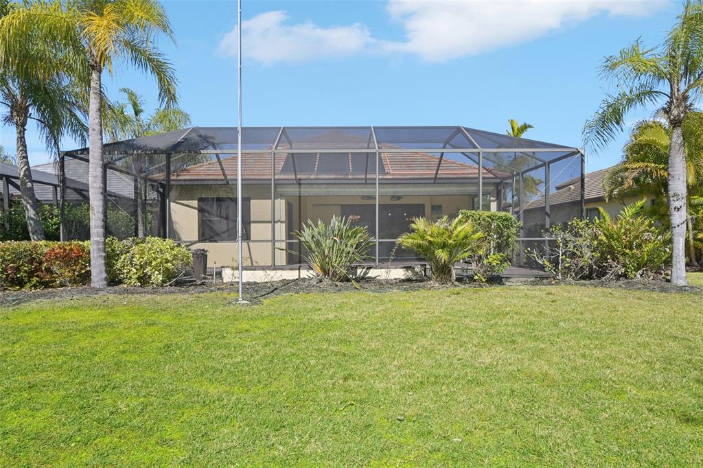 7526 Rio Bella Place Bradenton, FL 34201 - Photo 36 of 40 a view of a house with backyard and garden