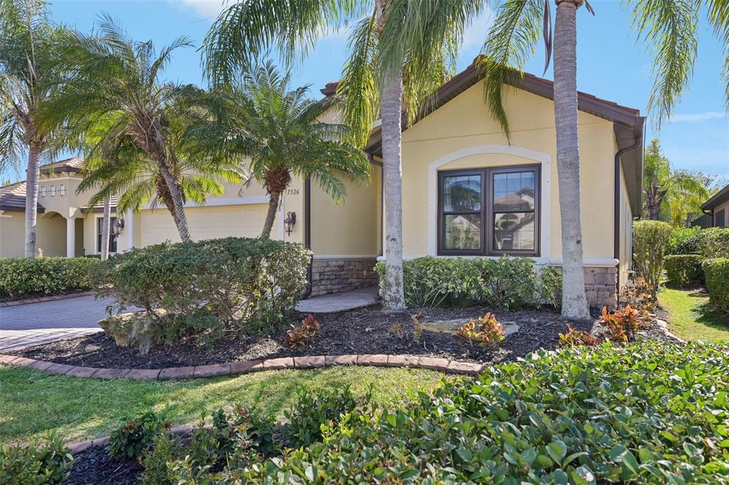 7526 Rio Bella Place Bradenton, FL 34201 - Photo 39 of 40 a front view of a house with garden