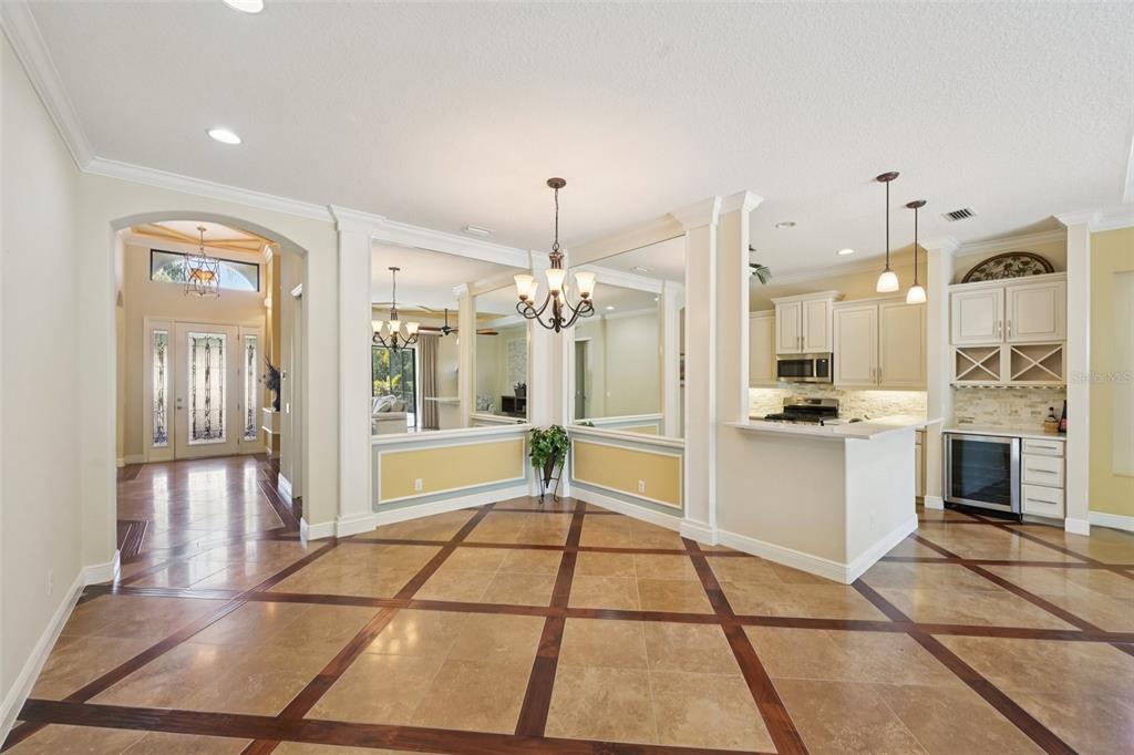 7526 Rio Bella Place Bradenton, FL 34201 - Photo 7 of 40 a large white kitchen with granite countertop a stove a sink and a refrigerator