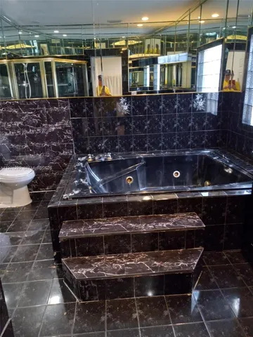 a bathroom with glass door