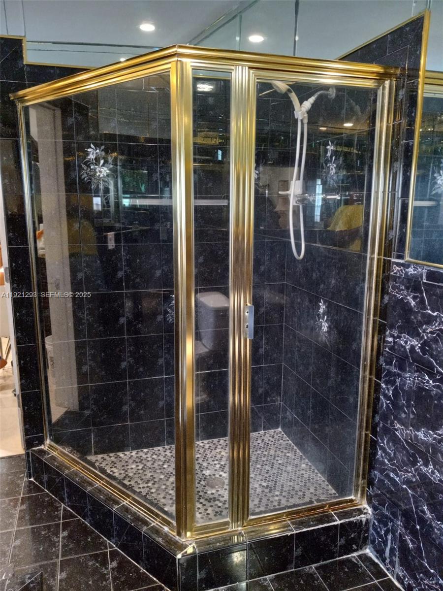 3041 Northwest 95th Terrace Miami, FL 33147 - Photo 16 of 22 a bathroom with glass door