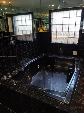 a kitchen with stove and cabinets