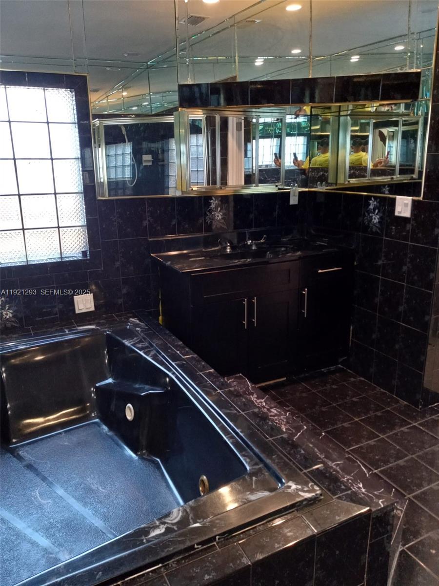 3041 Northwest 95th Terrace Miami, FL 33147 - Photo 18 of 22 a kitchen with stove and cabinets