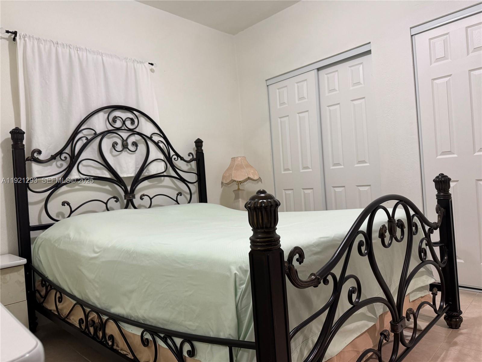 3041 Northwest 95th Terrace Miami, FL 33147 - Photo 9 of 22 a table with a chandelier