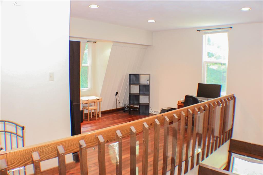 1222 Greenhill Road Pittsburgh, PA 15209 - Photo 7 of 25 a bedroom with furniture and wooden floor