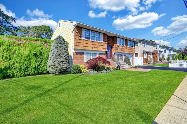 a front view of house with garden