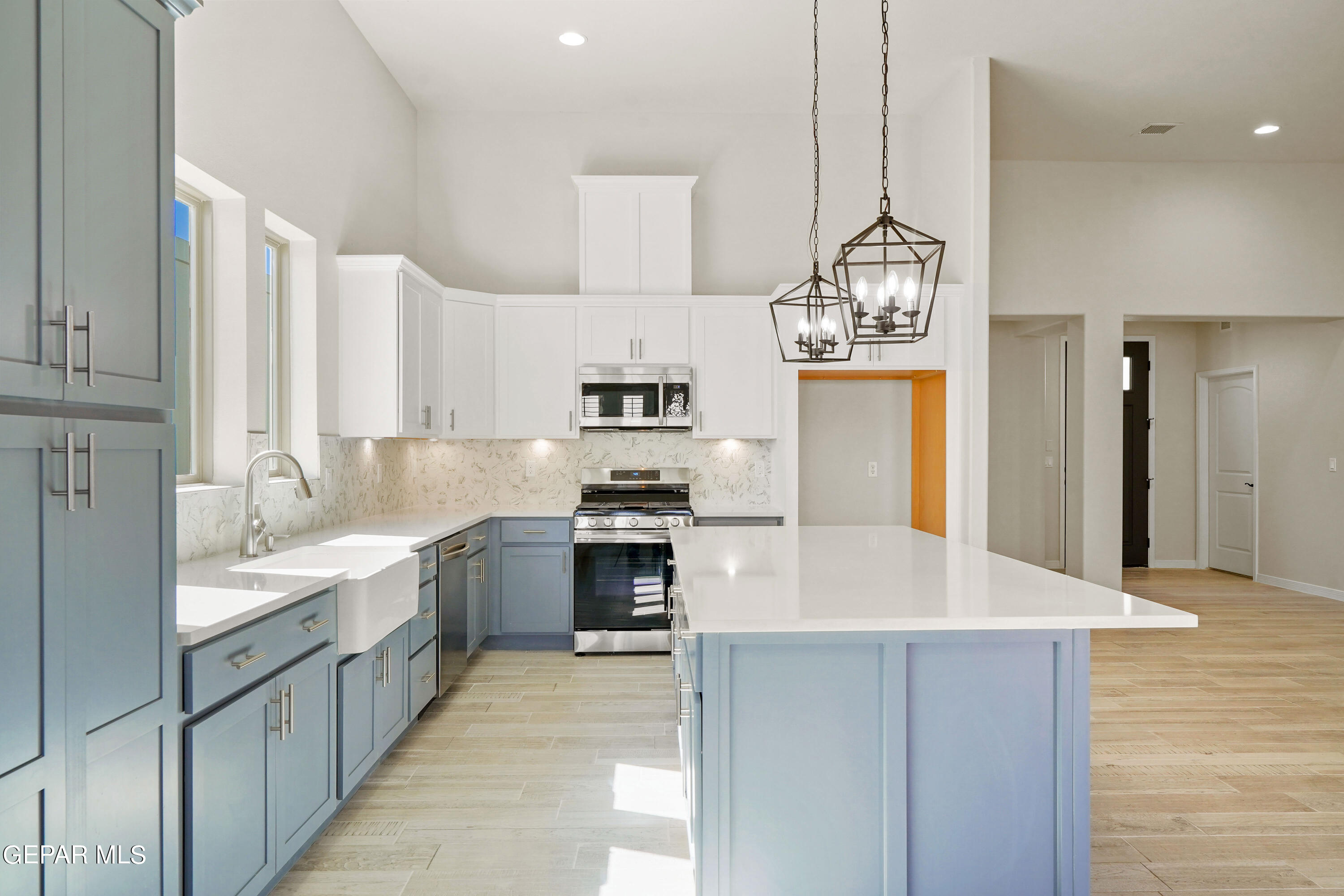 1734 Bit Way El Paso, TX 79911 - Photo 12 of 52 a large kitchen with kitchen island a sink stainless steel appliances and cabinets
