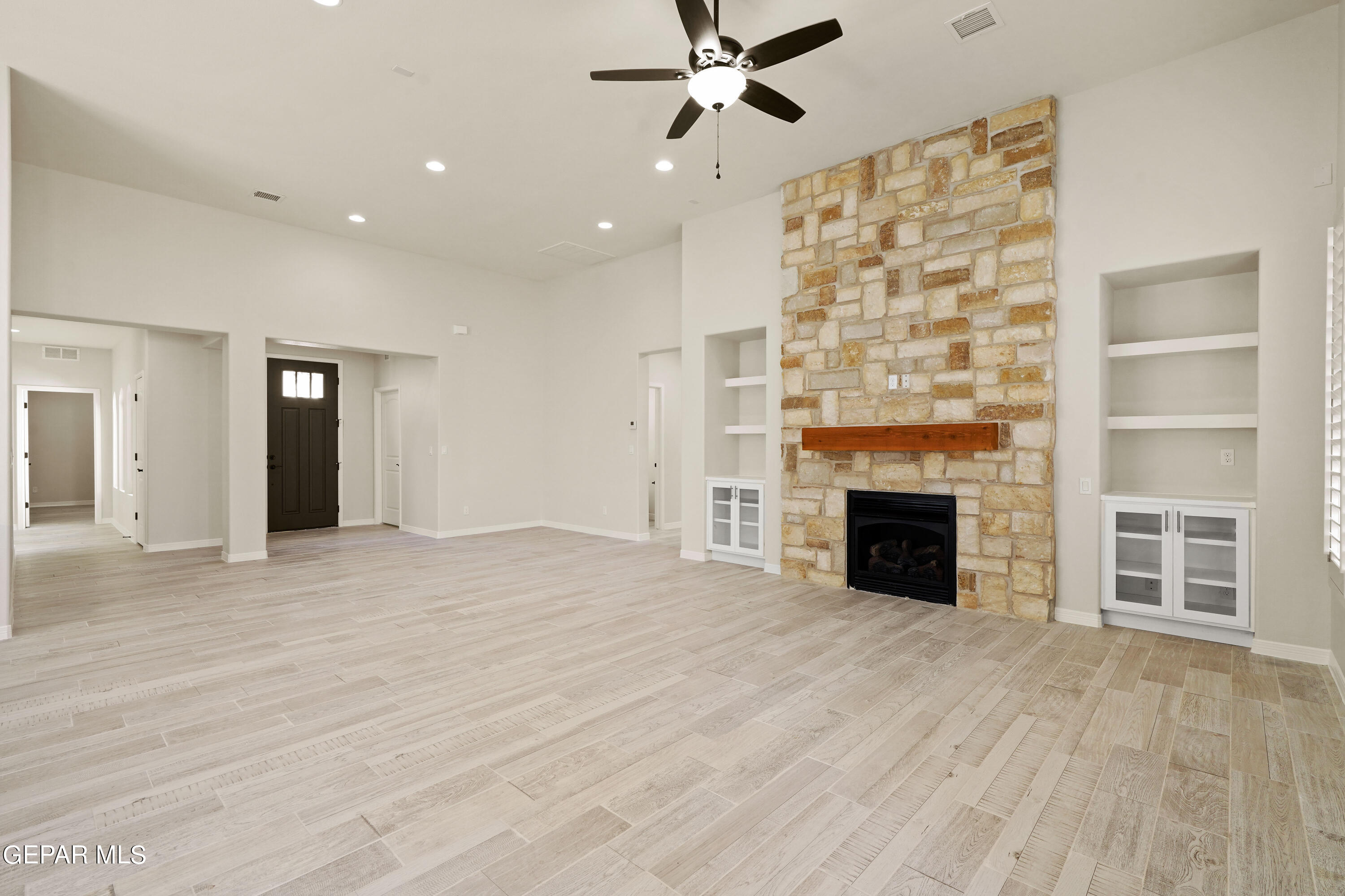 1734 Bit Way El Paso, TX 79911 - Photo 17 of 52 a view of an empty room with a fireplace and a window