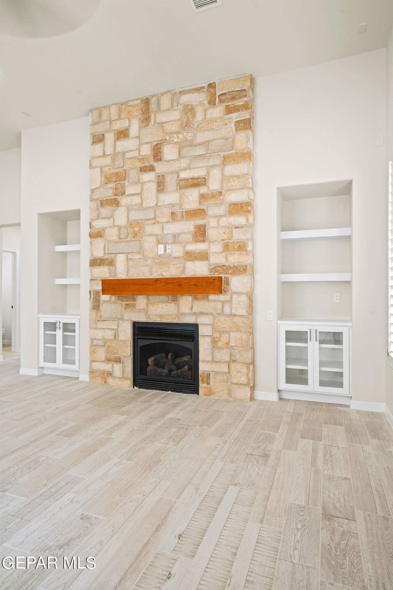 1734 Bit Way El Paso, TX 79911 - Photo 18 of 52 a view of an empty room with a fireplace and a window