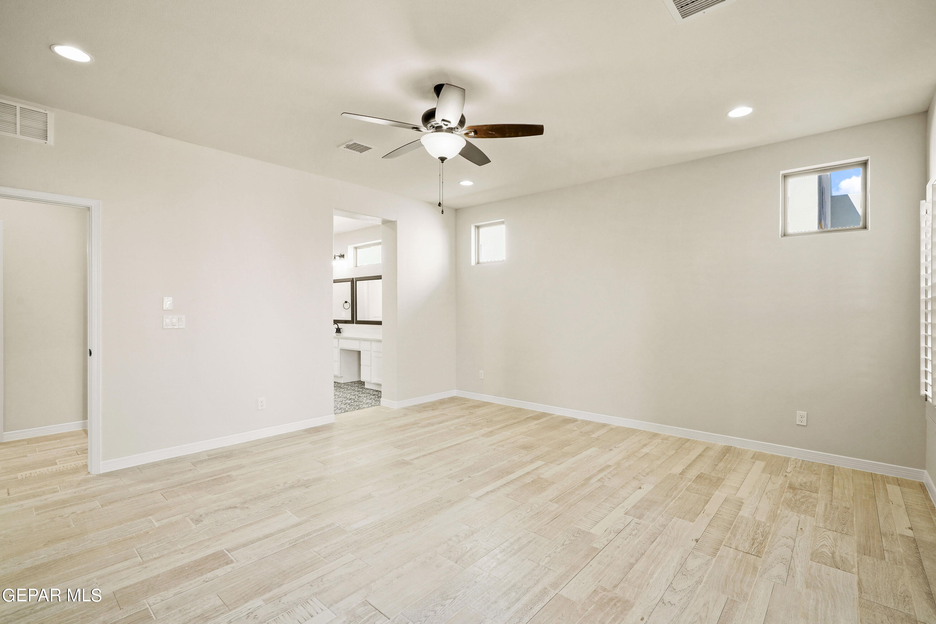 1734 Bit Way El Paso, TX 79911 - Photo 21 of 52 a view of empty room with wooden floor