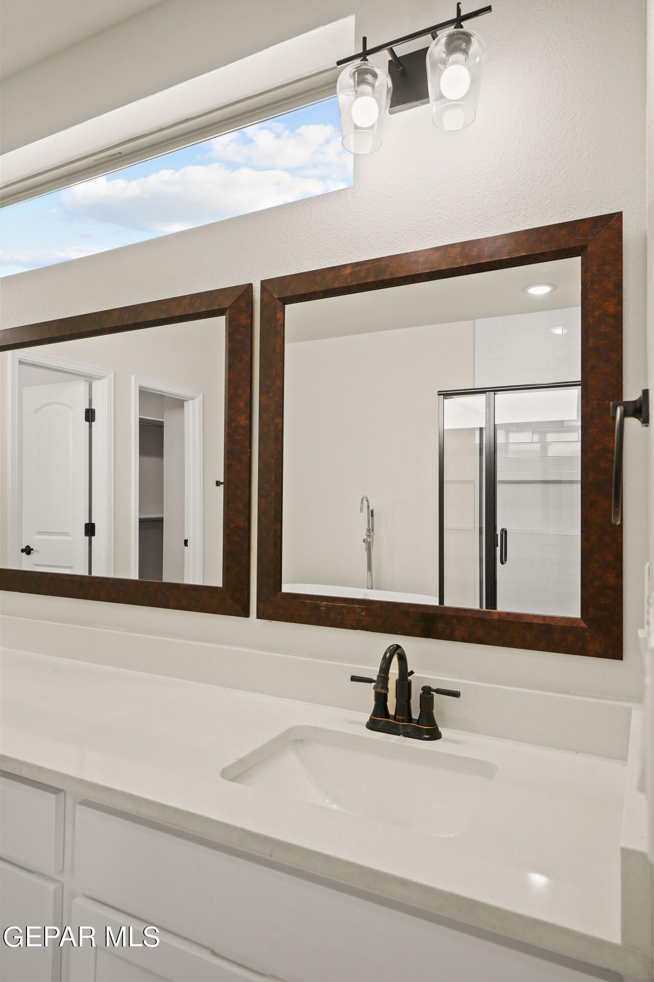 1734 Bit Way El Paso, TX 79911 - Photo 24 of 52 a bathroom with a sink and a mirror