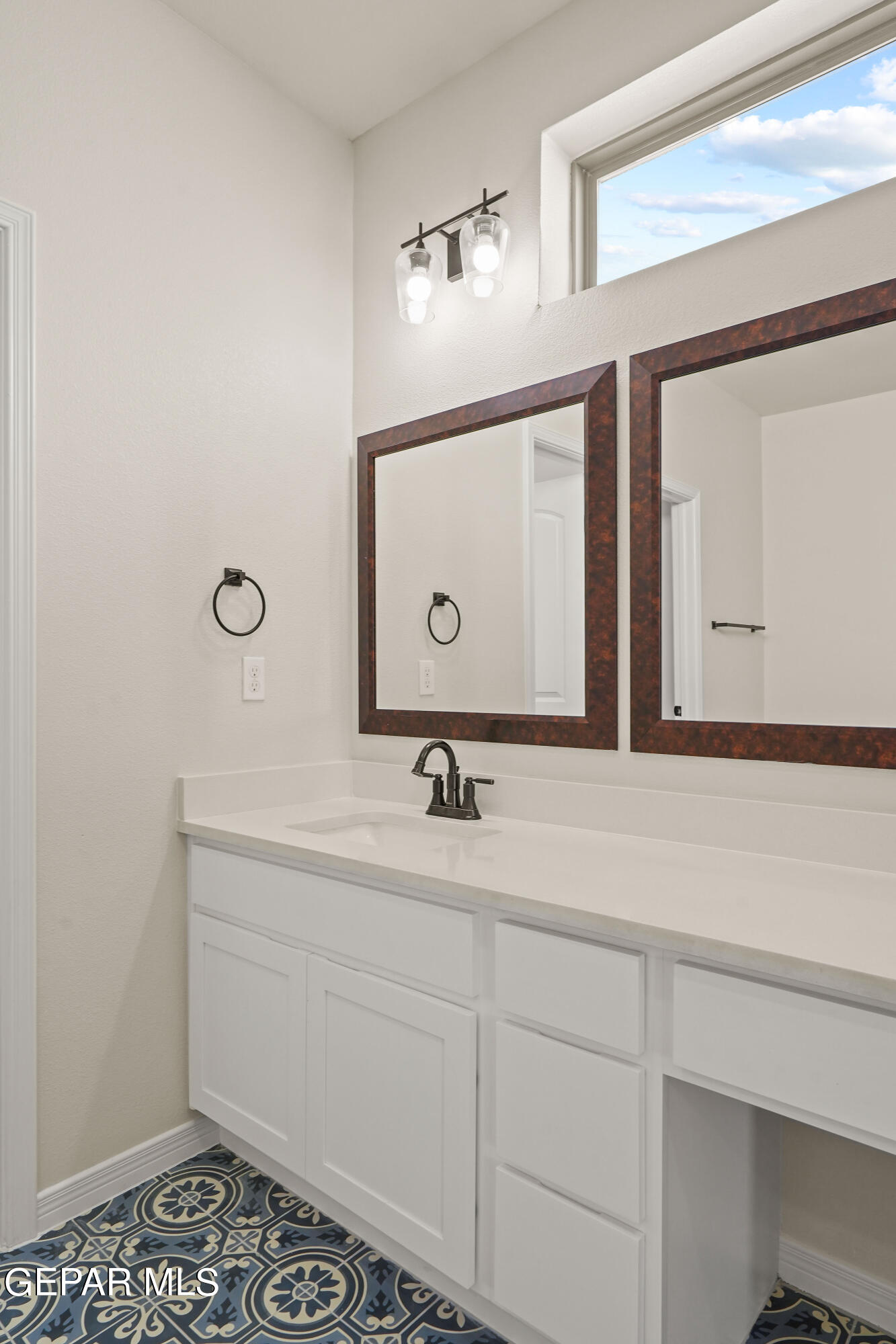 1734 Bit Way El Paso, TX 79911 - Photo 26 of 52 a bathroom with a sink and a mirror