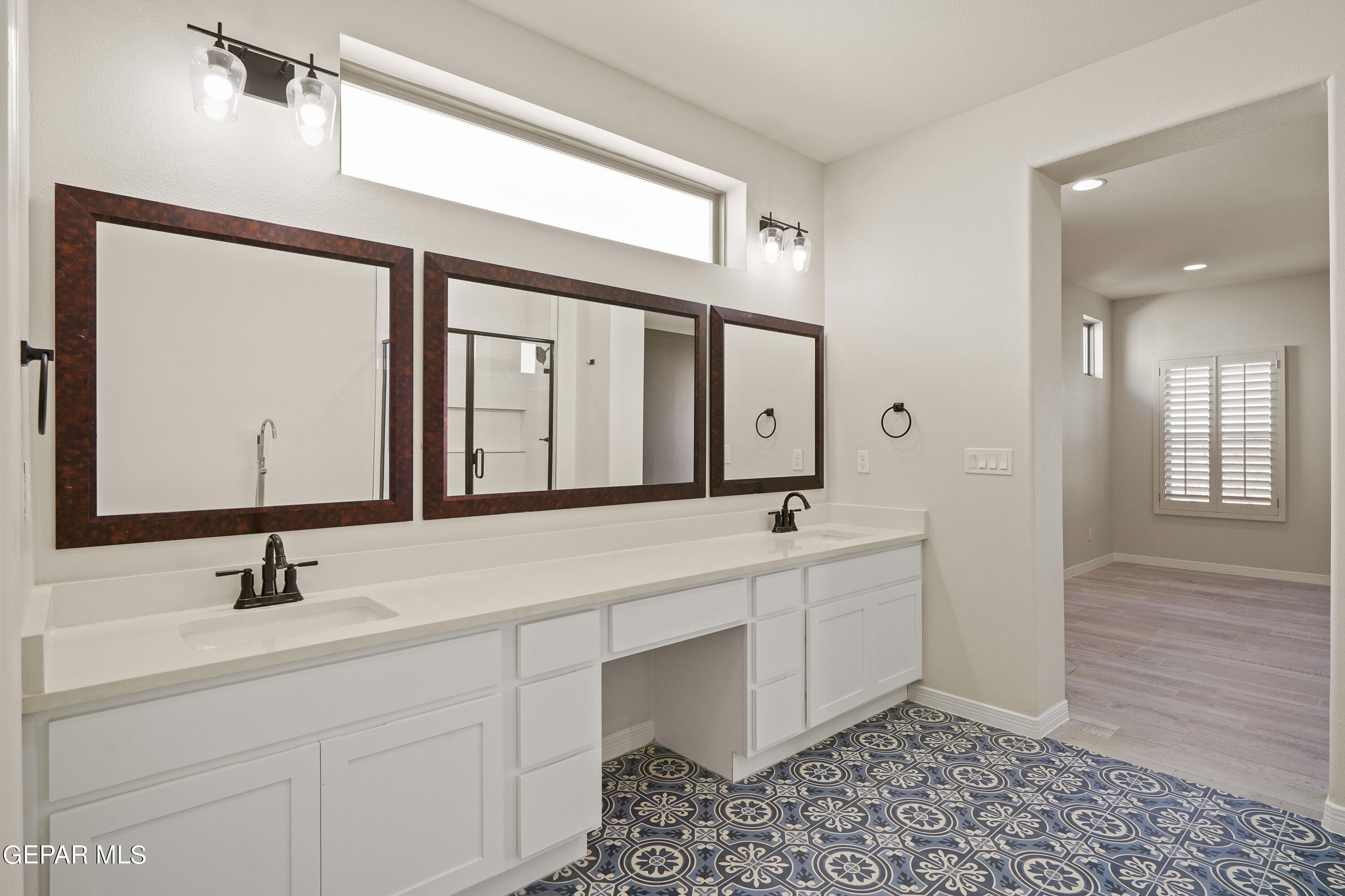 1734 Bit Way El Paso, TX 79911 - Photo 27 of 52 a bathroom with a double vanity sink mirror and bathtub