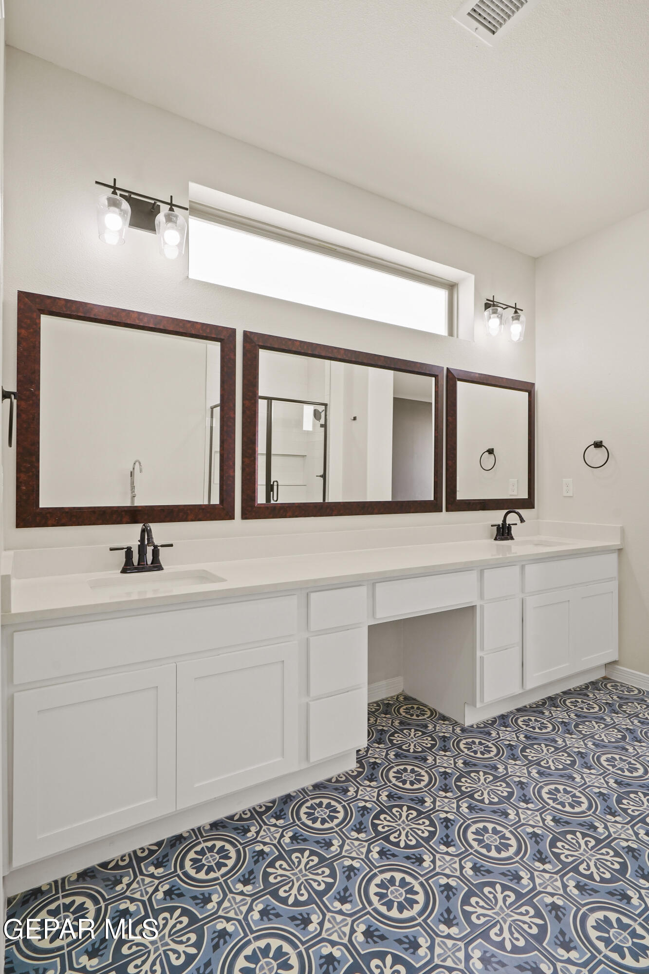 1734 Bit Way El Paso, TX 79911 - Photo 28 of 52 a bathroom with a sink and a mirror
