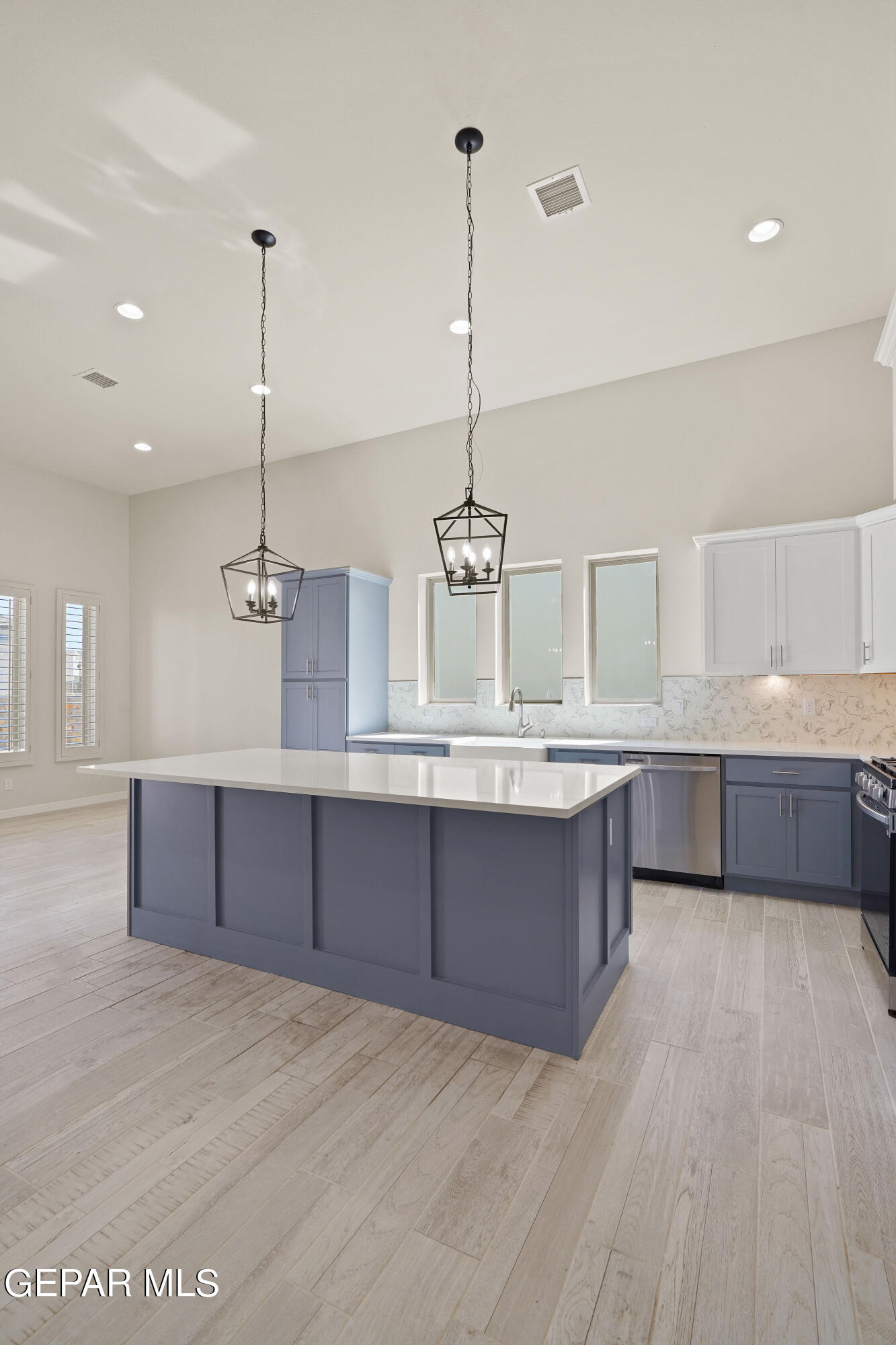 1734 Bit Way El Paso, TX 79911 - Photo 2 of 52 a large kitchen with kitchen island a sink stainless steel appliances and cabinets