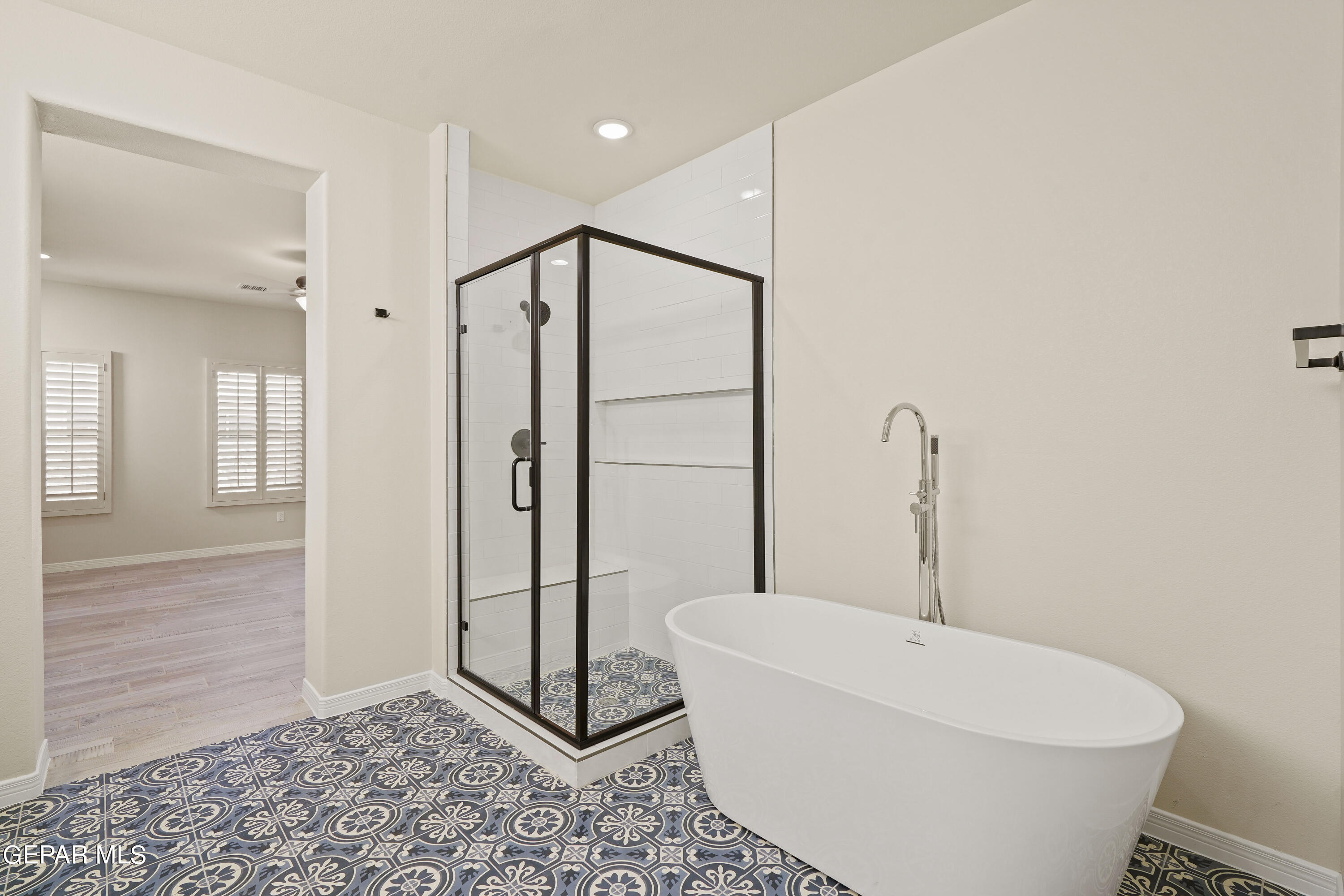 1734 Bit Way El Paso, TX 79911 - Photo 30 of 52 a bathroom with a bathtub and shower