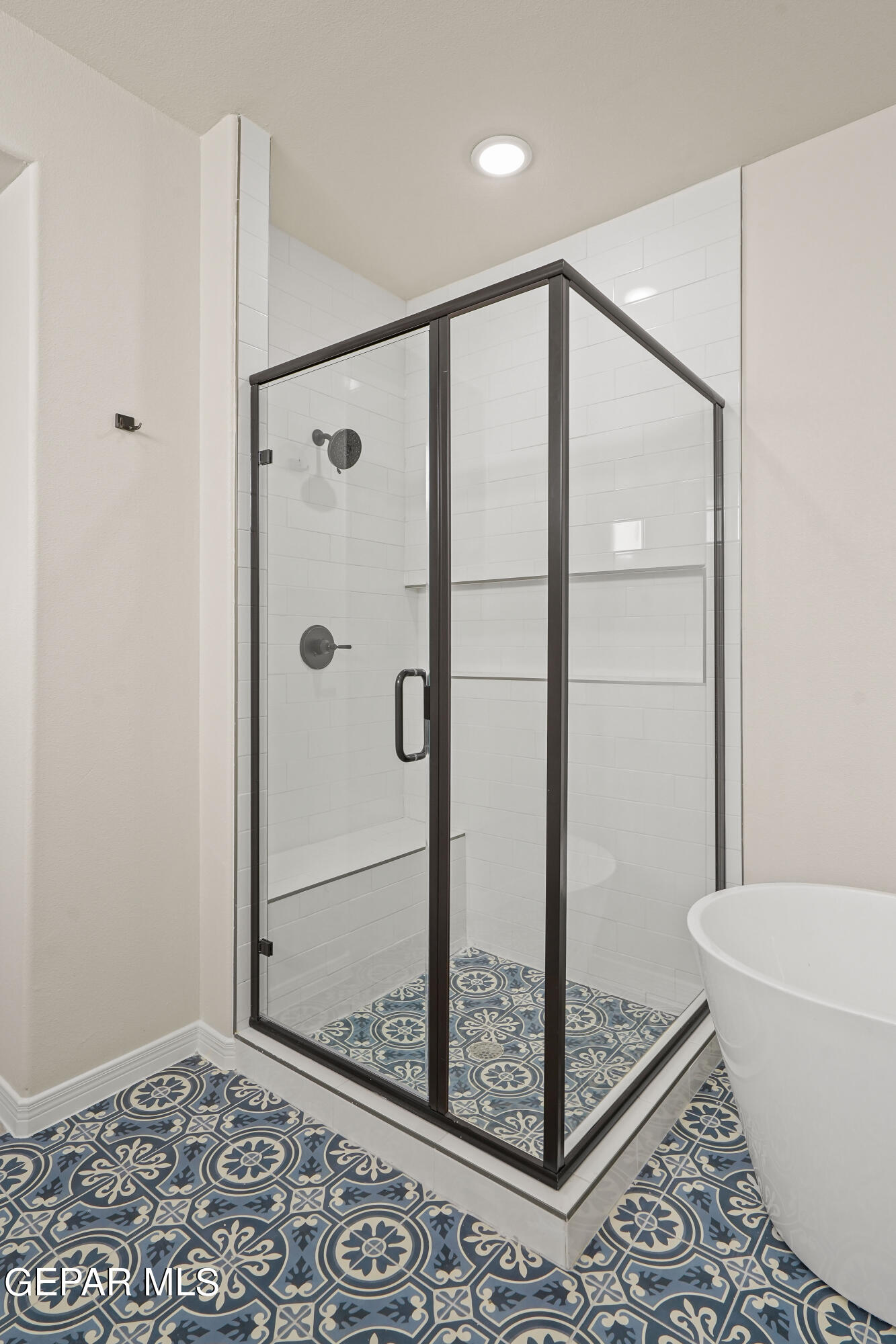 1734 Bit Way El Paso, TX 79911 - Photo 31 of 52 a bathroom with a glass shower door