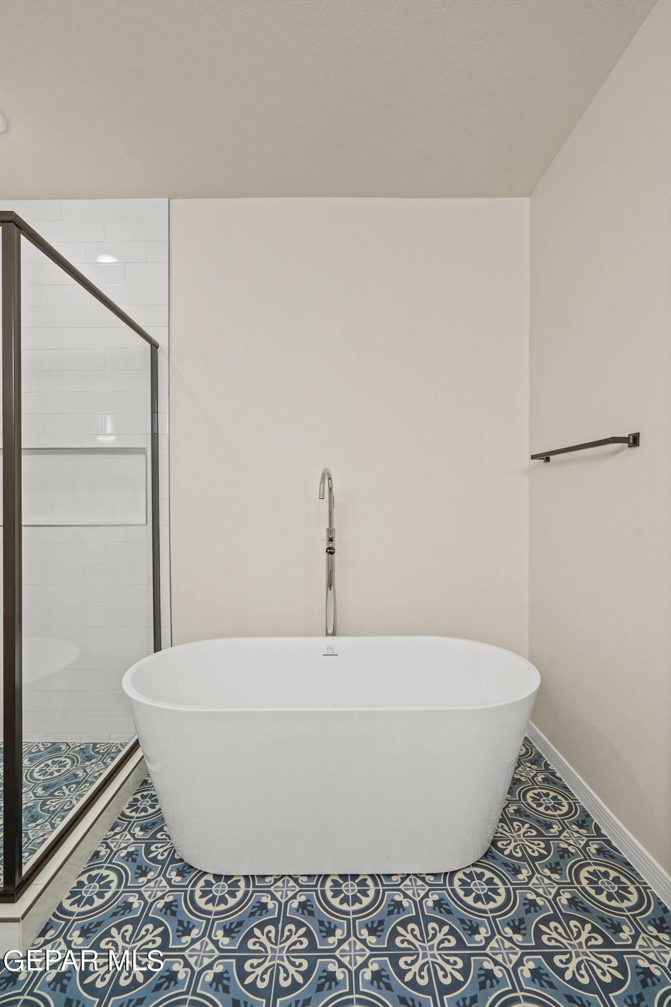 1734 Bit Way El Paso, TX 79911 - Photo 32 of 52 a white tub sitting next to a shower