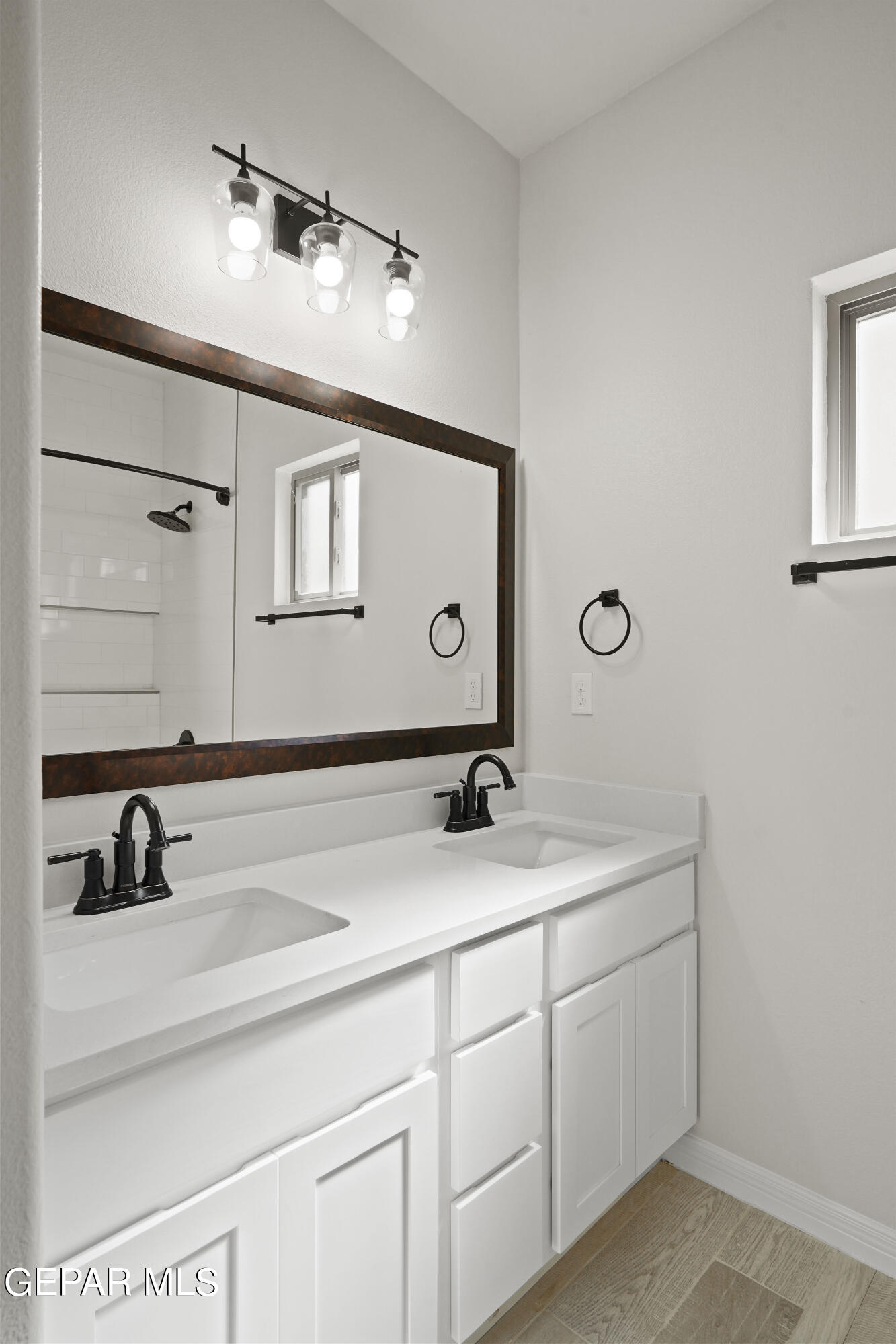 1734 Bit Way El Paso, TX 79911 - Photo 41 of 52 a bathroom with a sink and a mirror