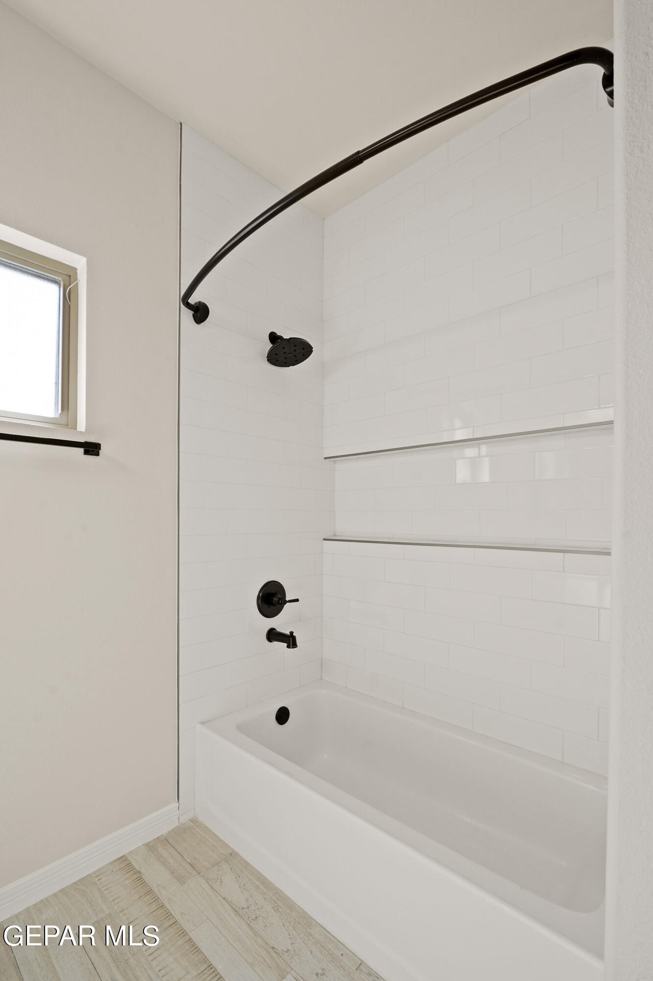 1734 Bit Way El Paso, TX 79911 - Photo 43 of 52 a bathroom with a bathtub