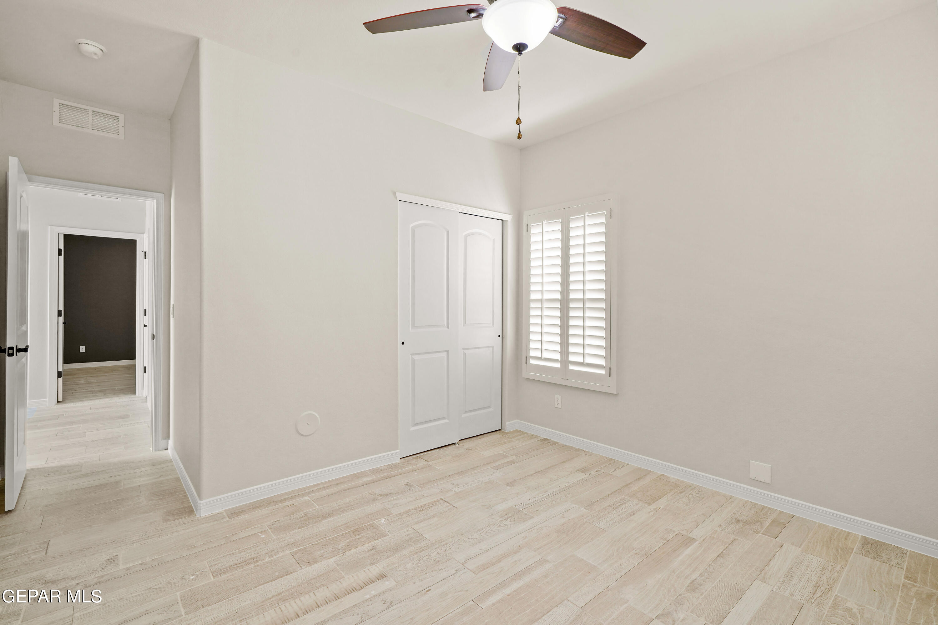 1734 Bit Way El Paso, TX 79911 - Photo 47 of 52 an empty room with chandelier fan and windows