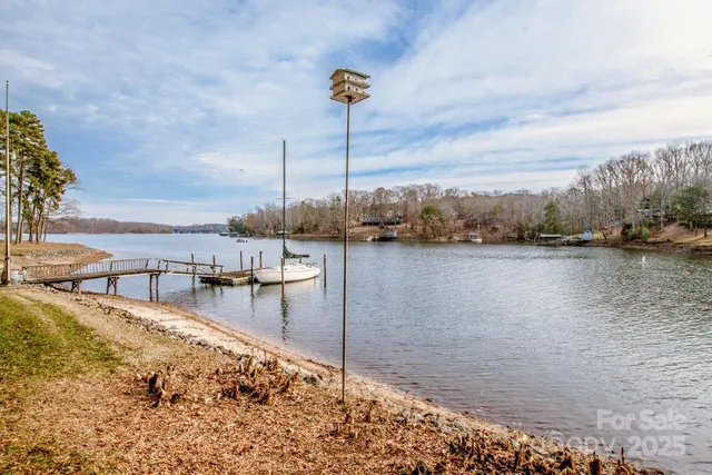 a view of a swimming pool with a lake view