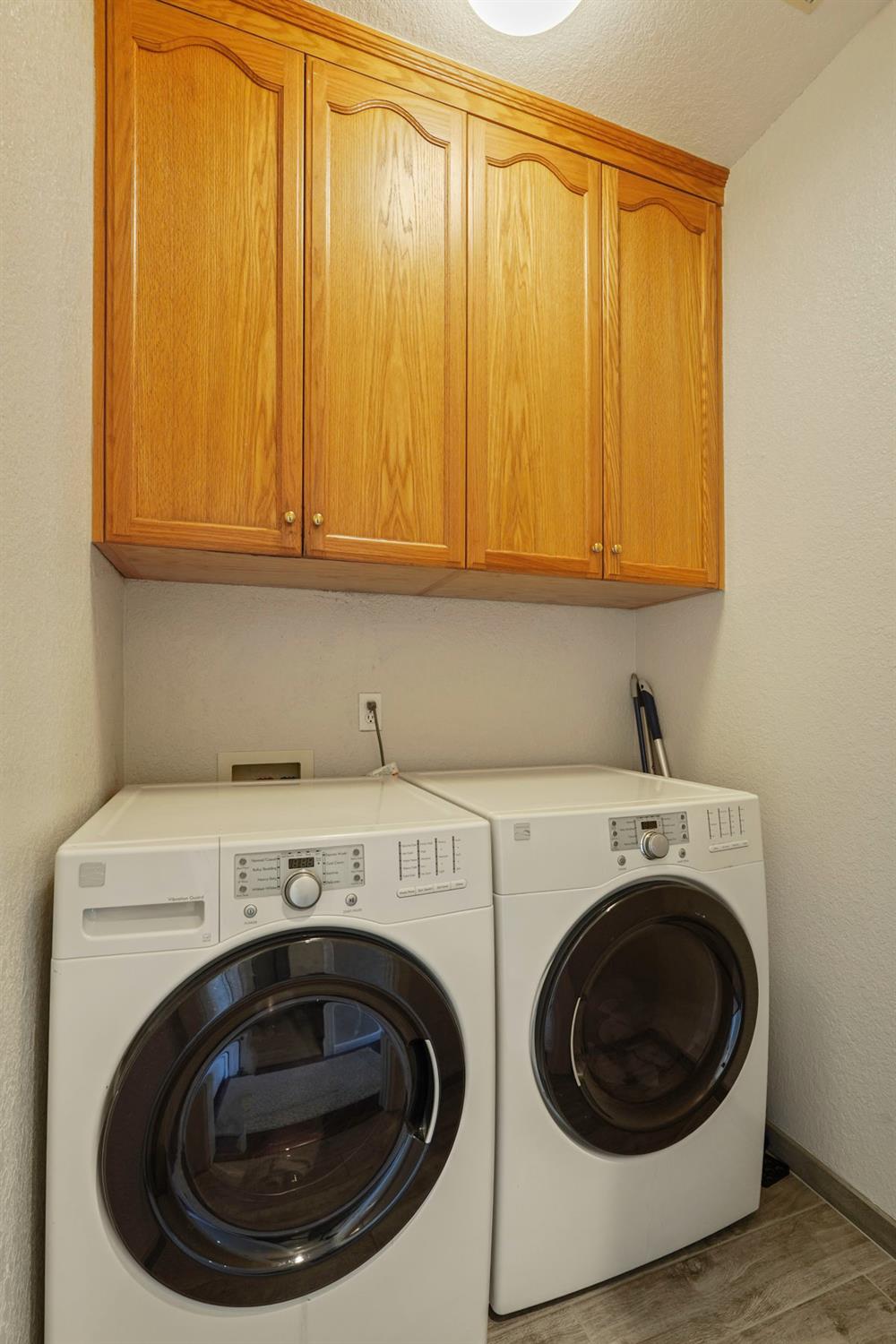 18432 Ironstone Street Woodbridge, CA 95258 - Photo 24 of 50 Inside laundry room with cabinetry.