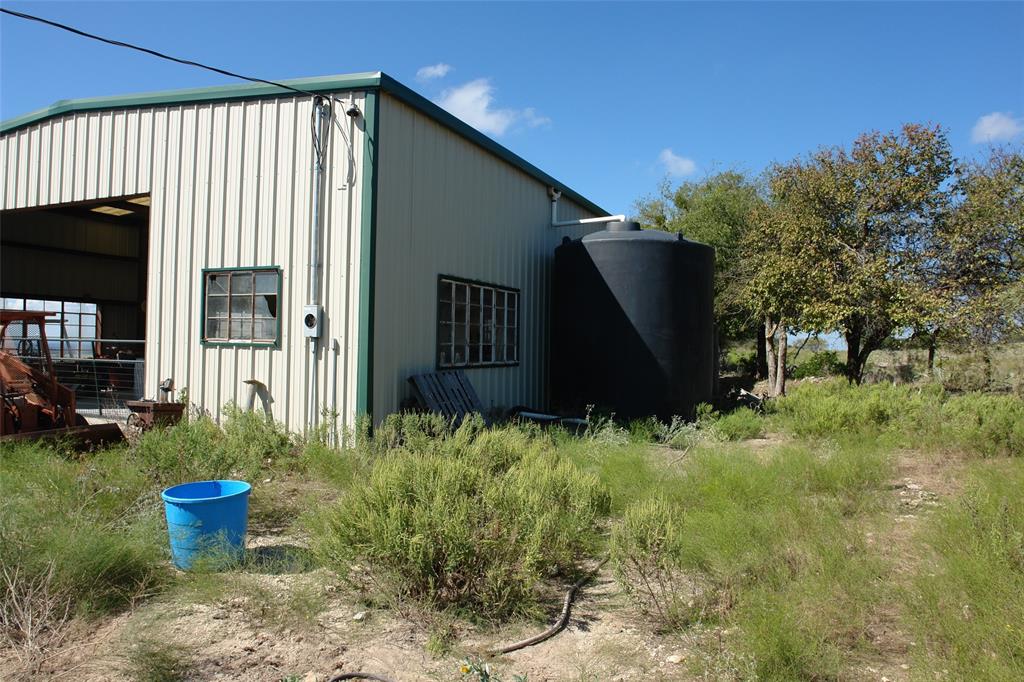 131 County Road 317 Goldthwaite, TX 76844 - Photo 5 of 39 a backyard of a house with table and chairs