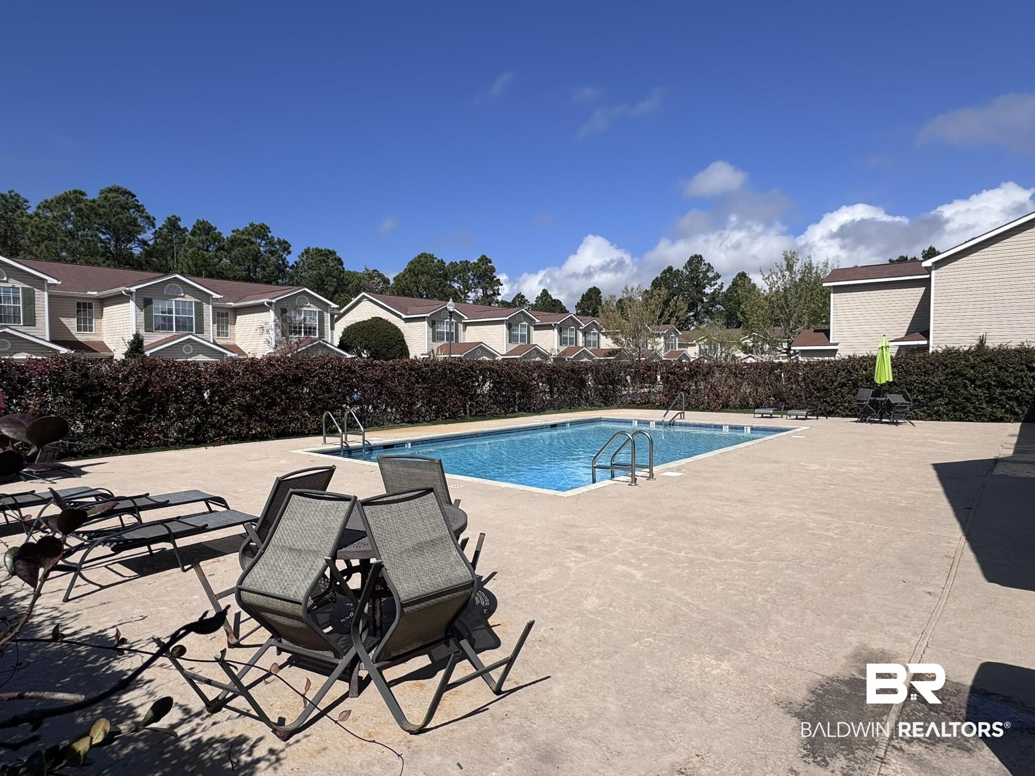 1517 Regency Road, Unit 131 Gulf Shores, AL 36542 - Photo 21 of 21 Community pool with a patio area and a residential view