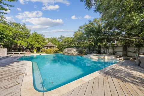 a view of a swimming pool with a patio
