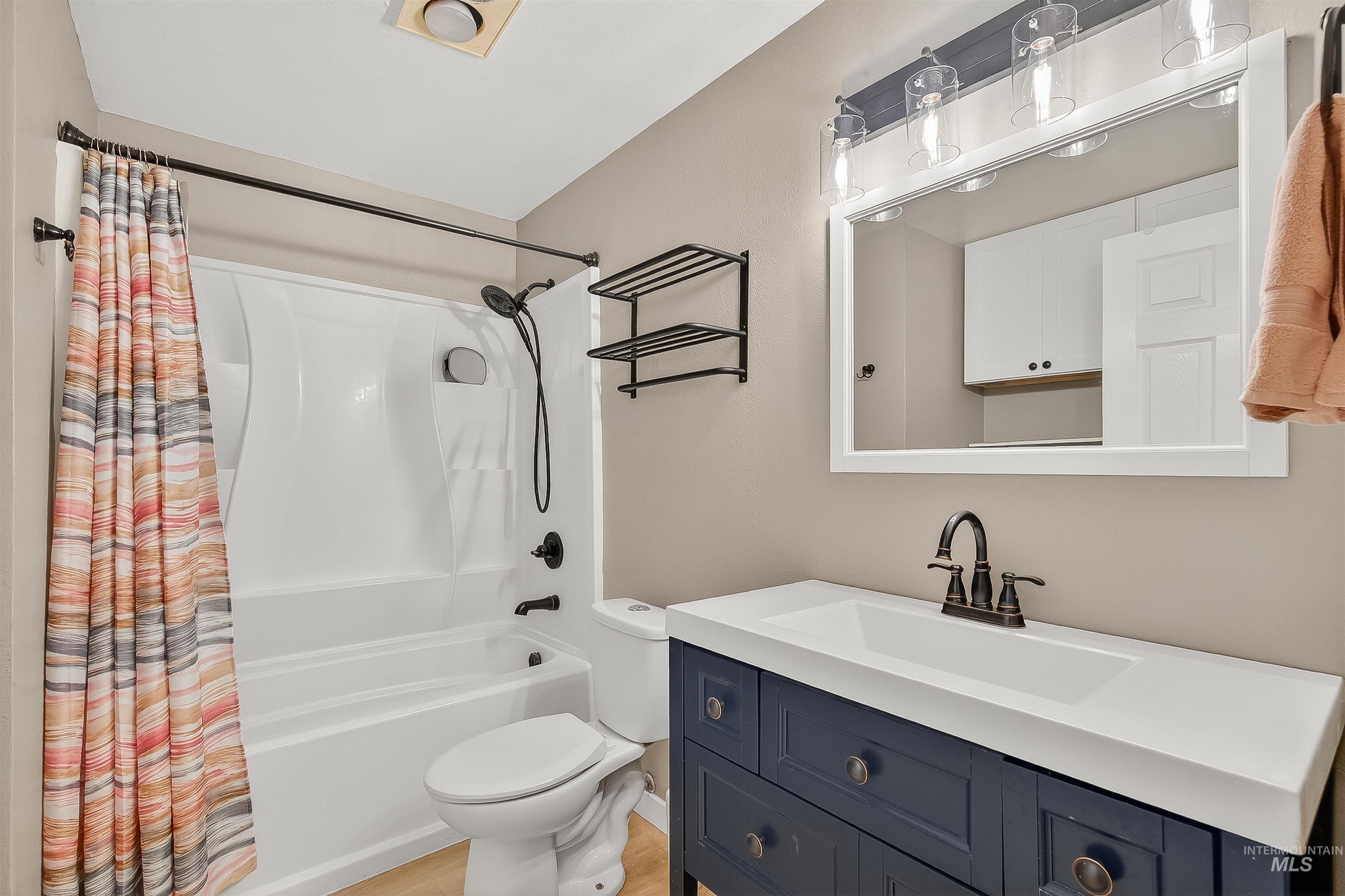 406 2nd Street Asotin, WA 99402 - Photo 14 of 37 Bathroom with shower / bath combination with curtain and vanity