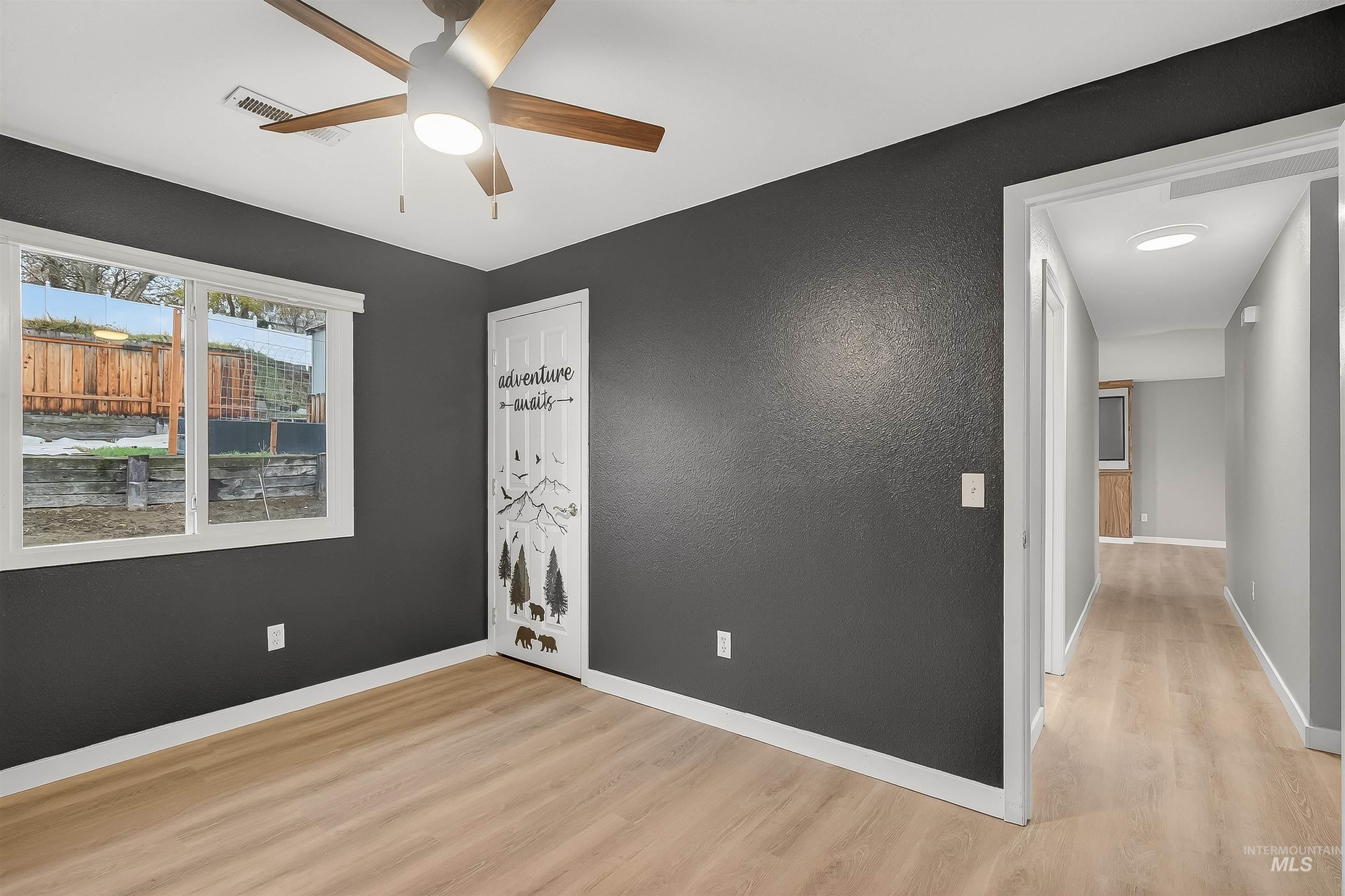 406 2nd Street Asotin, WA 99402 - Photo 20 of 37 Unfurnished room featuring light wood-type flooring and a ceiling fan