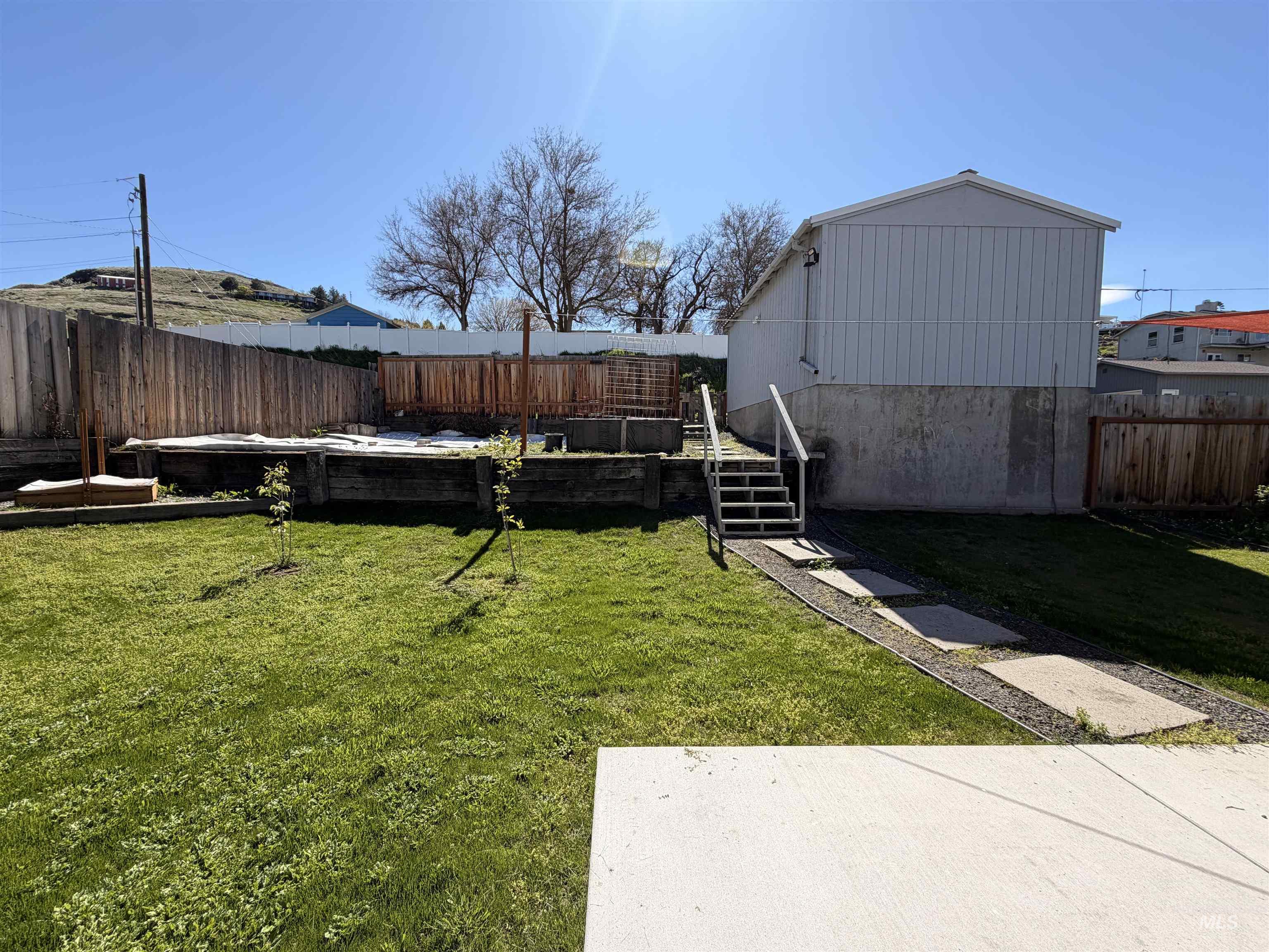 406 2nd Street Asotin, WA 99402 - Photo 23 of 25 Fenced backyard with a garden