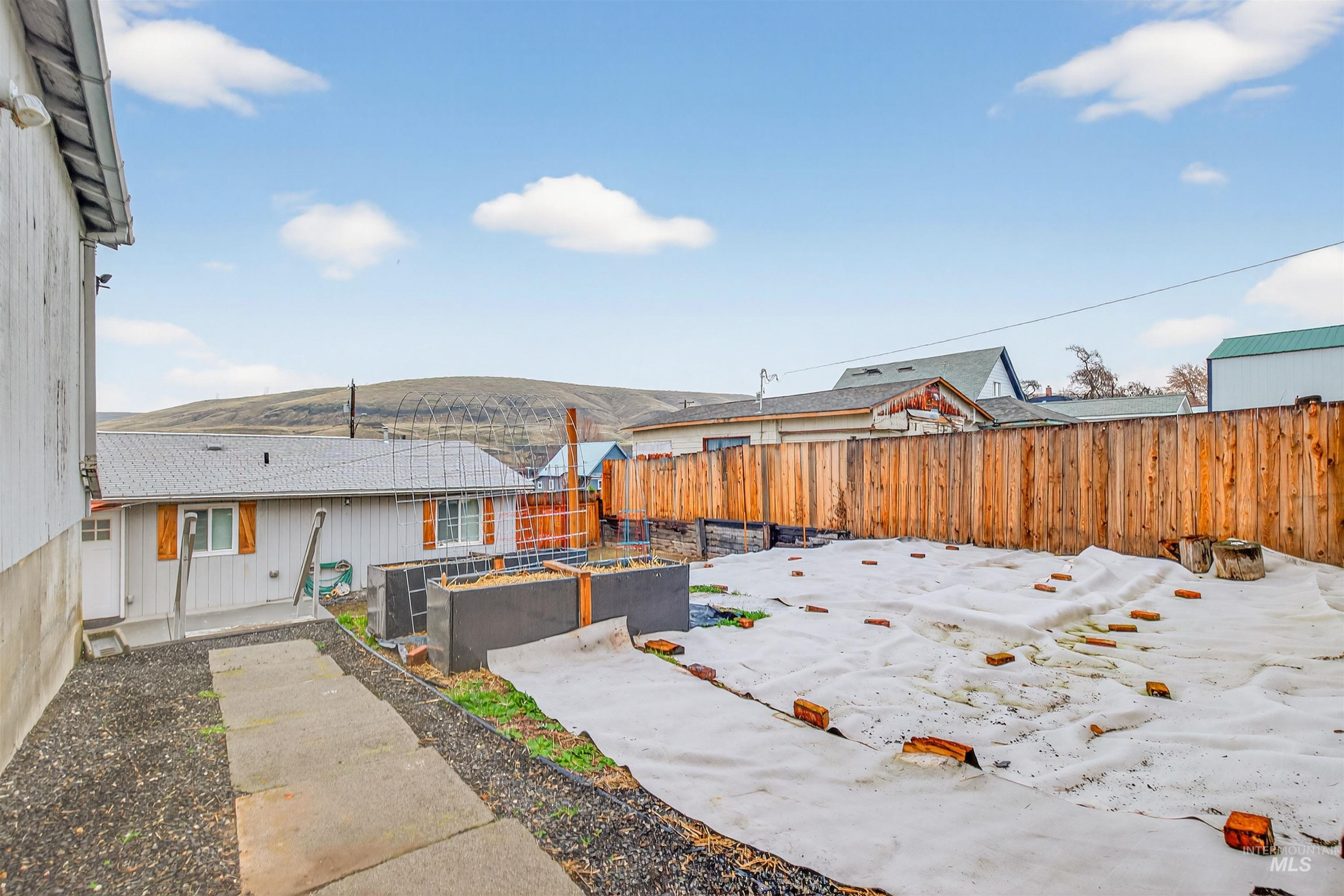 406 2nd Street Asotin, WA 99402 - Photo 28 of 37 Fenced backyard with a garden