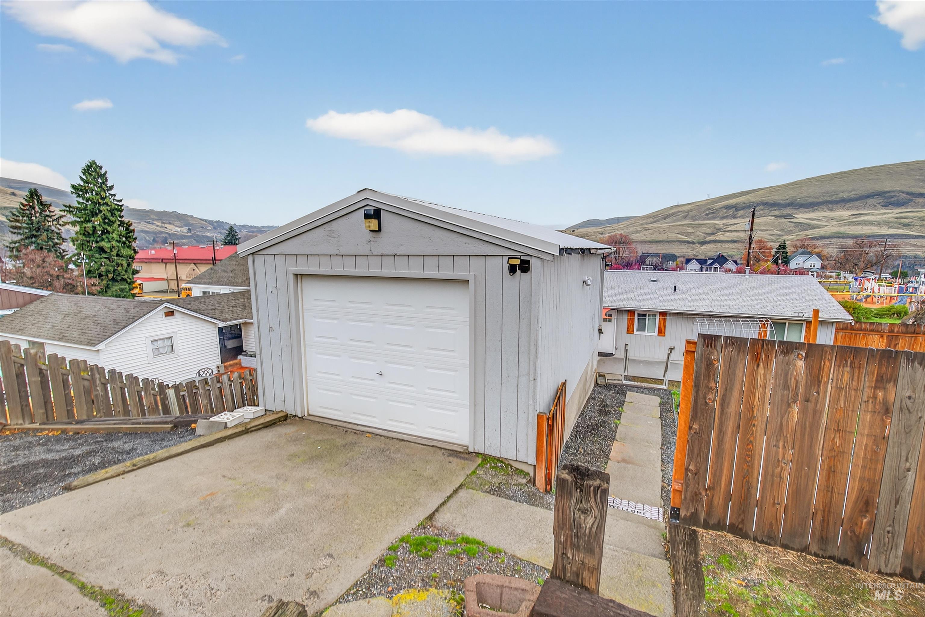 406 2nd Street Asotin, WA 99402 - Photo 31 of 37 Detached garage with a mountain view and driveway